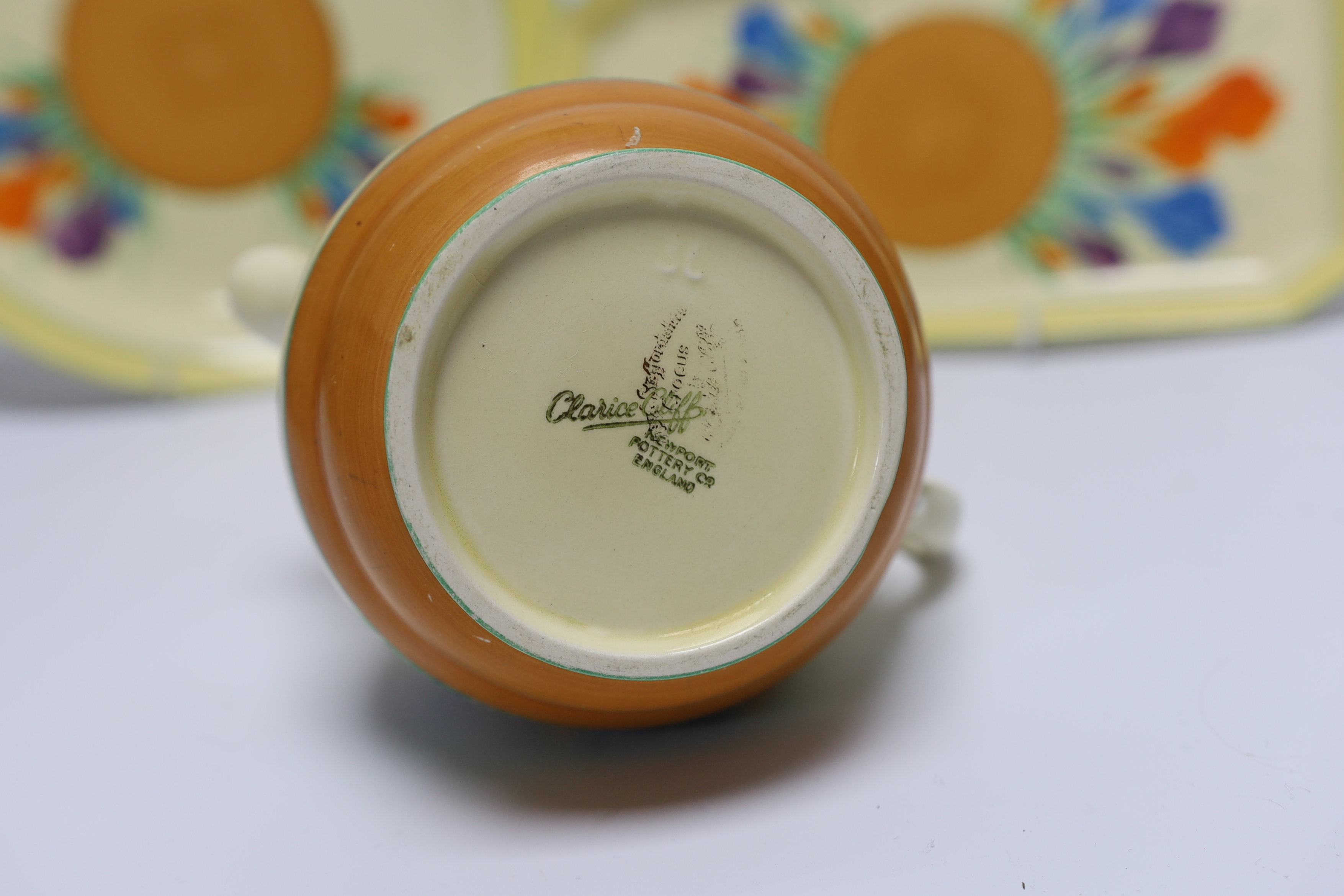 A Clarice Cliff Crocus jug and two dishes, largest 30cm long